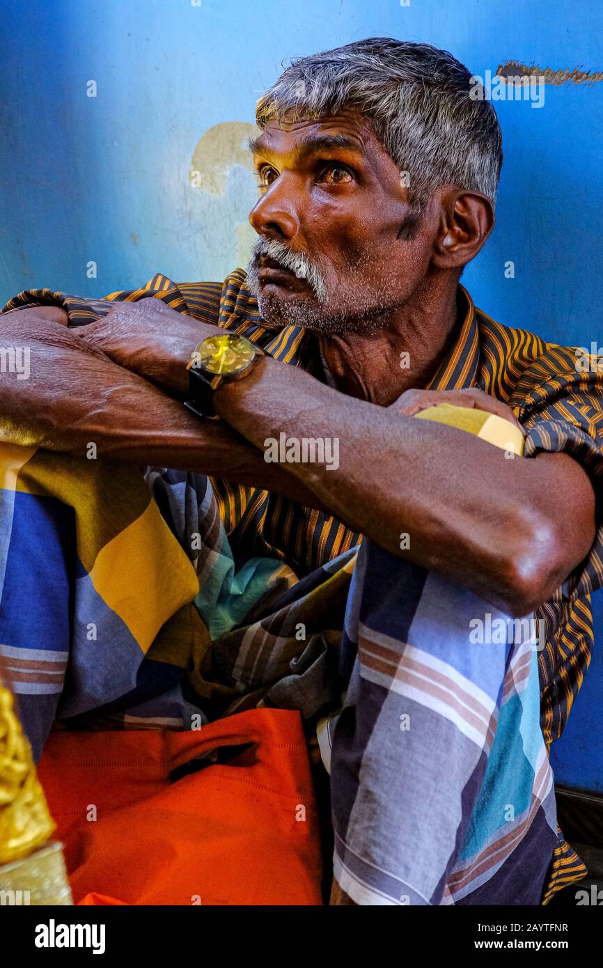 Kandy, Sri Lanka - January 2020: Man traveling by train from Nanu Oya to Kandy on January 25, 2020 in Kandy, Sri Lanka. Stock Photo