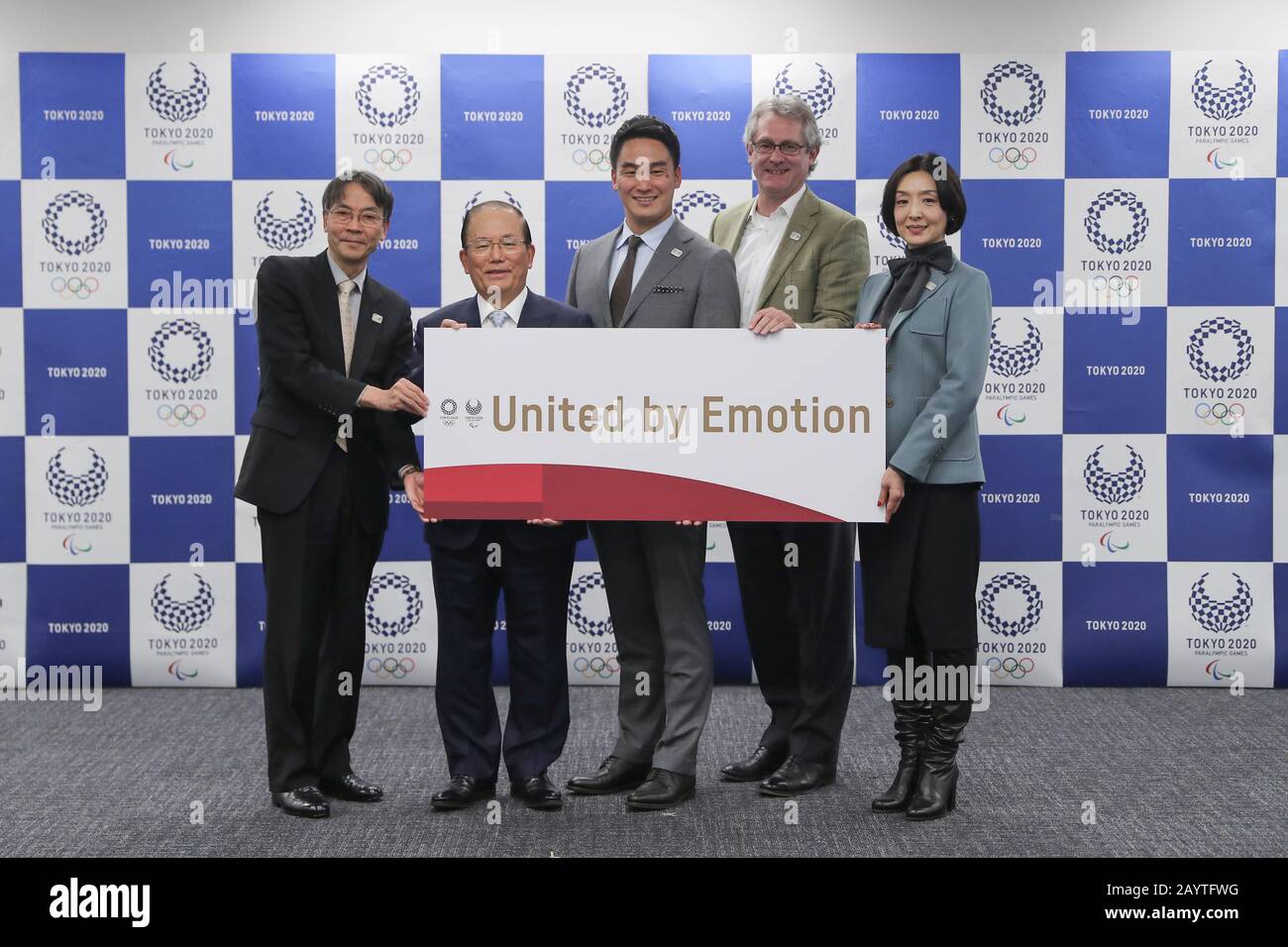 Tokyo, Japan. 17th Feb, 2020. Attendees pose for photos with the motto during the Tokyo 2020 Games Motto unveiling press conference in Tokyo, Japan, on Feb. 17, 2020. "United by Emotion" will be the official Motto of the Tokyo Olympic and Paralympic Games, organizers announced here on Friday. Credit: Du Xiaoyi/Xinhua/Alamy Live News Stock Photo