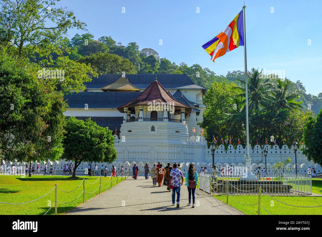 Kandy, Sri Lanka - January 2020: People visiting the Temple of the Tooth of Buddha on January 26, 2020 in Kandy, Sri Lanka. Stock Photo