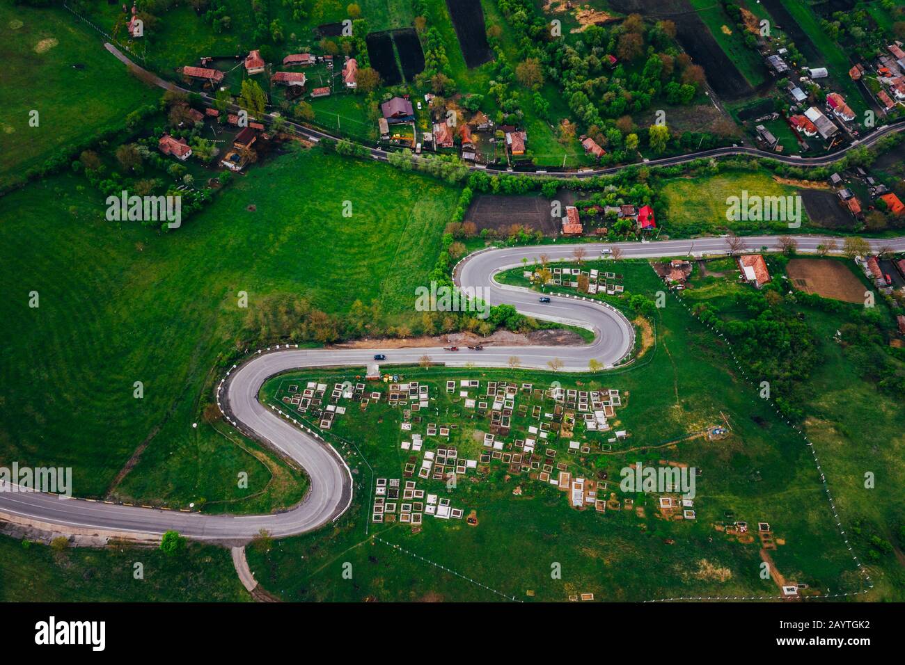 Curvy road from a drone view and agriculture fields Stock Photo