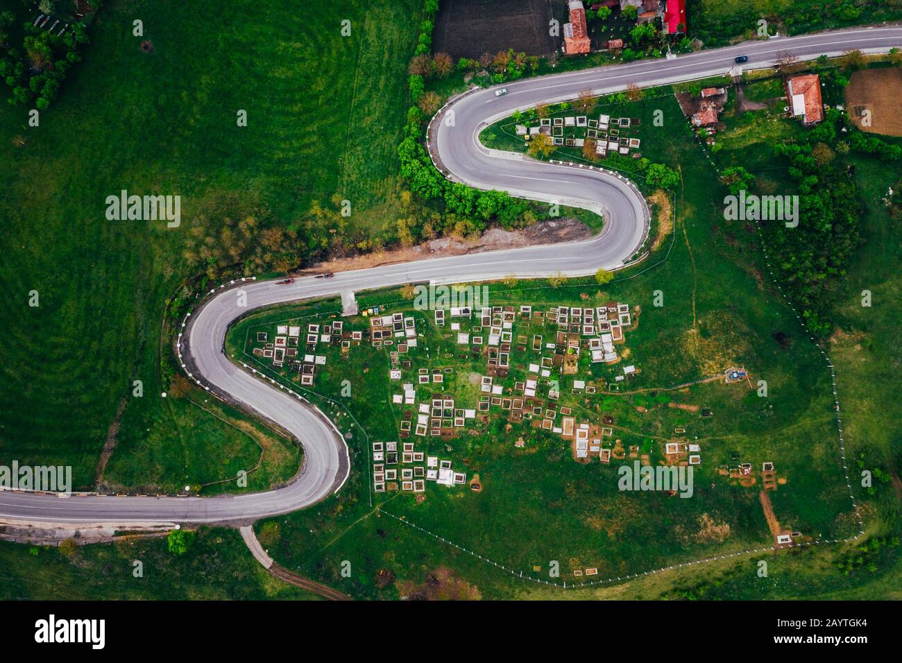 Curvy road from a drone view and agriculture fields Stock Photo