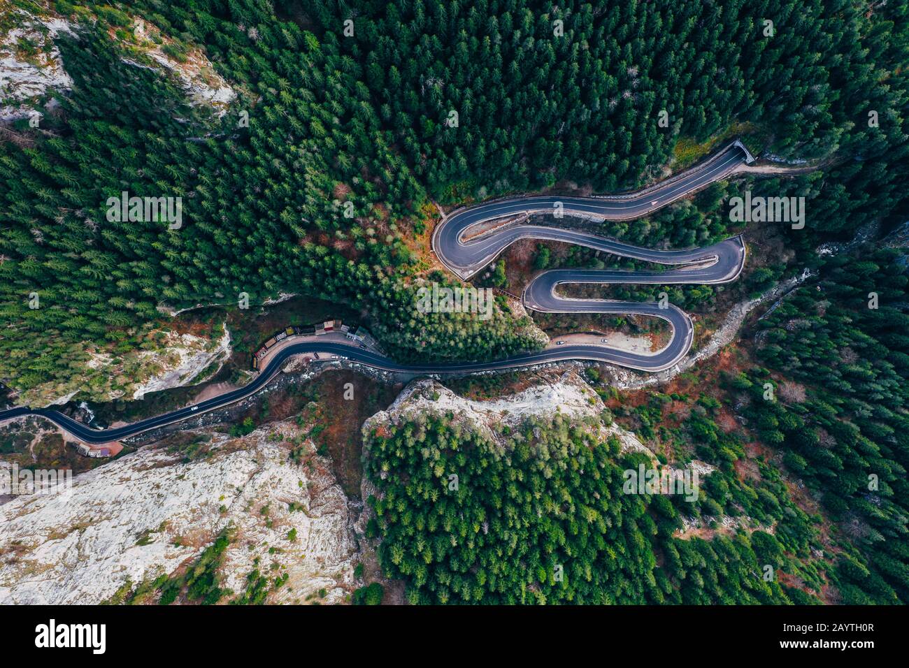 Drone view of winding forest road in the middle of Bicaz Gorge, Transylvania Stock Photo
