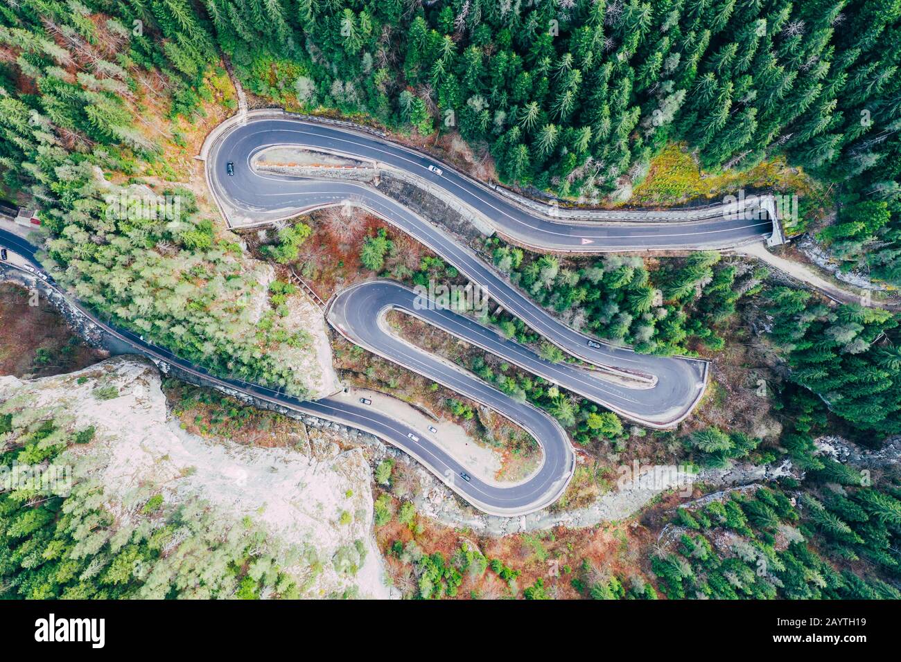 Drone view of winding forest road in the middle of Bicaz Gorge, Transylvania Stock Photo