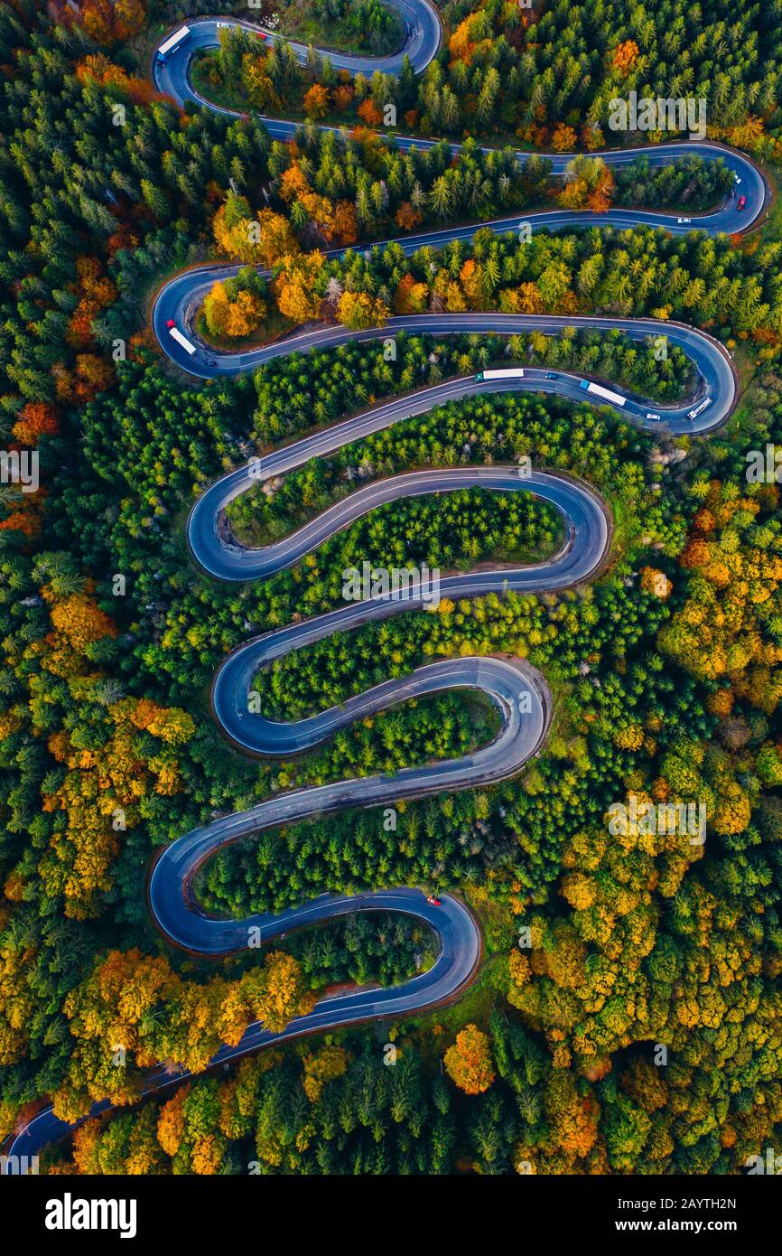 Scenic curvy road seen from a drone in autumn. Cheia, Romania. Stock Photo