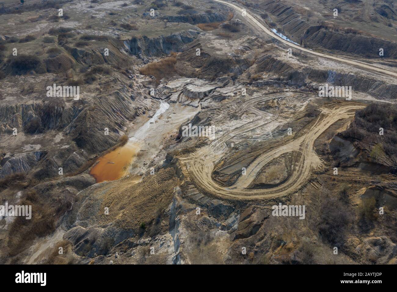 Aerial view of an open mine pit. Exploitation and nature pollution Stock Photo