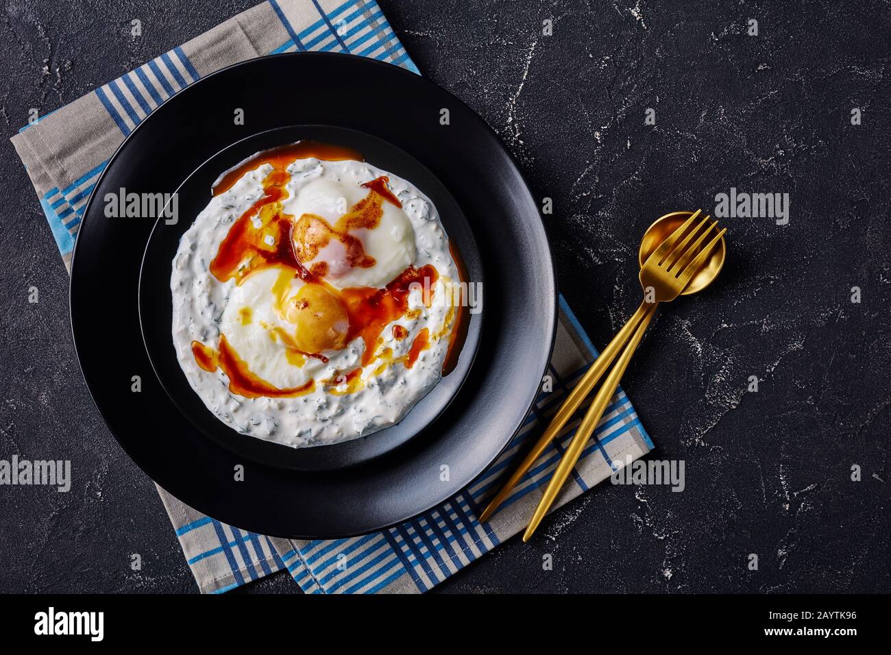 cilbir, poached eggs in yogurt sauce topped with spicy frothed butter