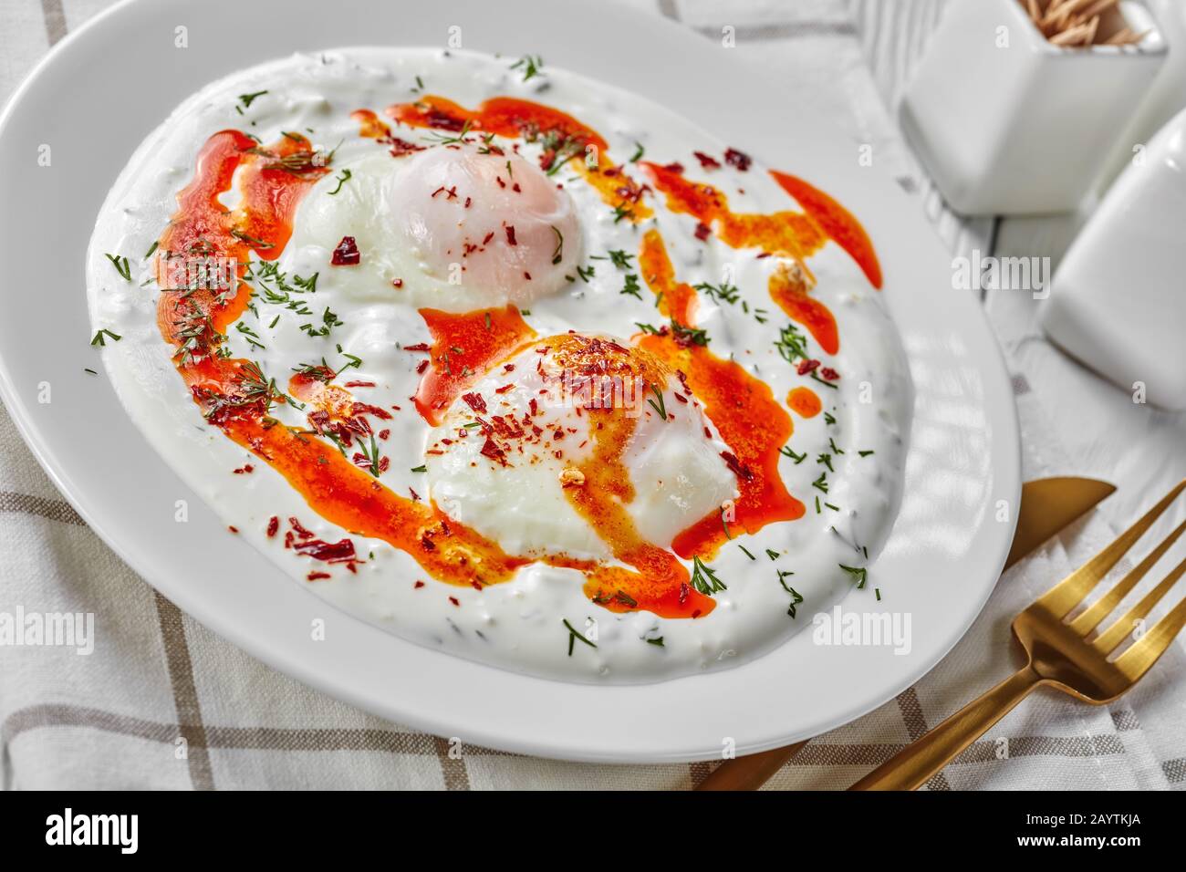 Turkish eggs with greek yogurt and aleppo pepper butter sauce, cilbir