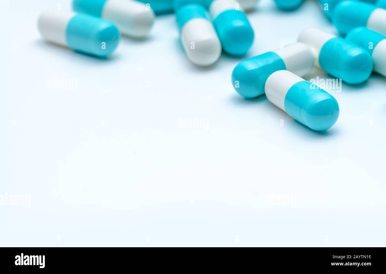 Selective focus antibiotic capsule pills on white background. Antibiotic drug resistance concept. Pharmaceutical industry. Antimicrobial medication Stock Photo