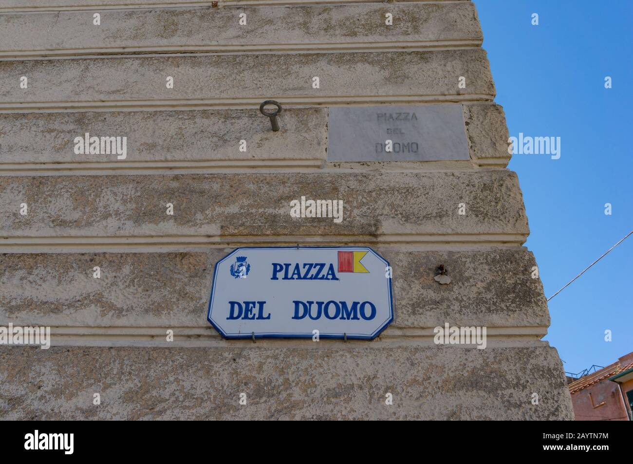 Orbetello, Italy - September 22, 2013: Street sign indicating Piazza del Duomo, Cathedral Square. Tourist and urban navigation in the historic city of Stock Photo
