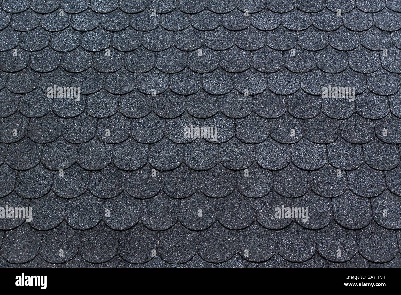 Black bitumen roof shingles with beaver tail pattern Stock Photo