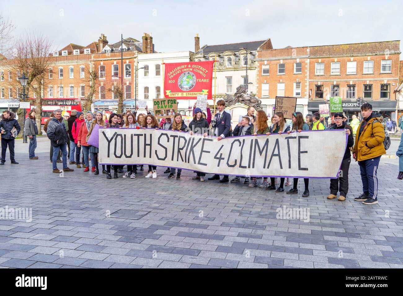 School children at a small youth strike for climate change demonstration holding their banner and placards Stock Photo