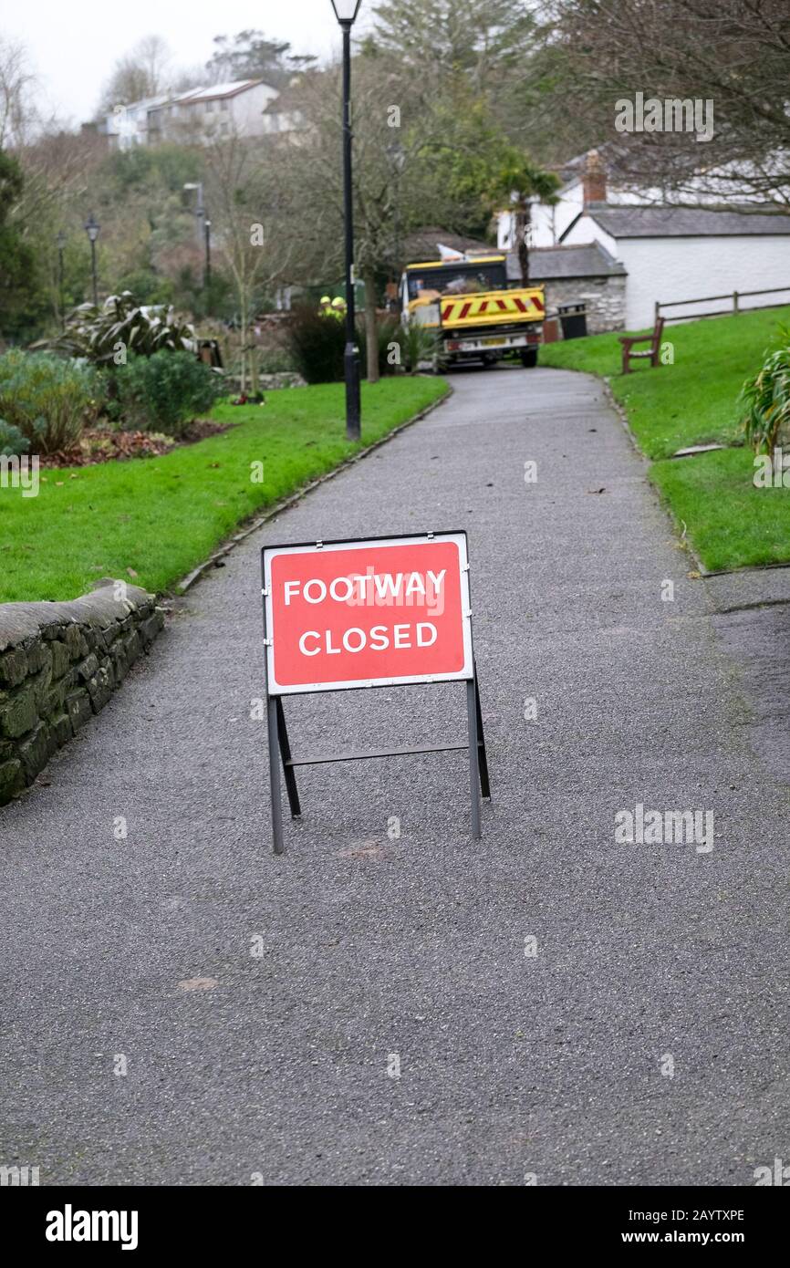 A sign indicating a footway footpath closed in a park in Newquay in Cornwall. Stock Photo