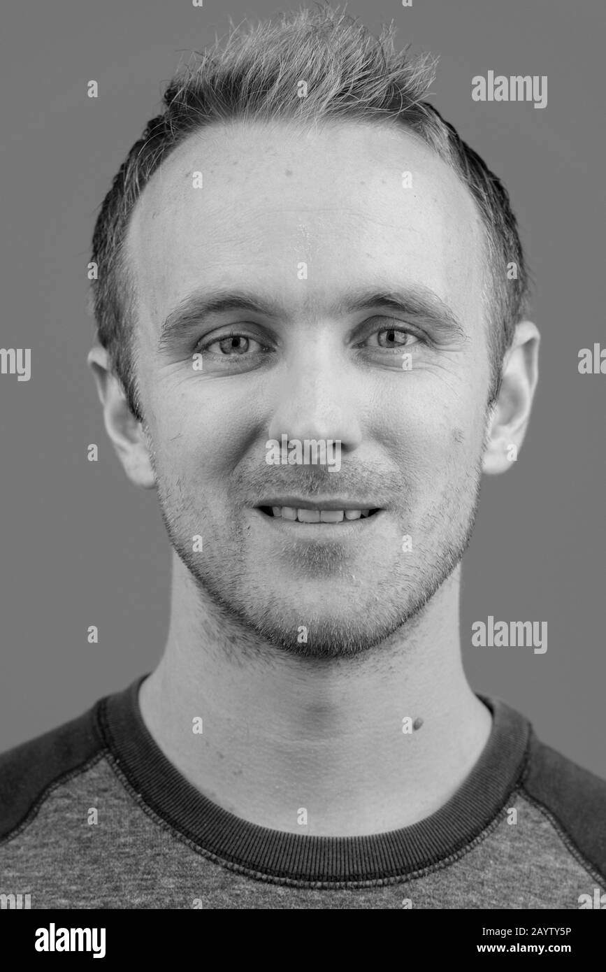 Face of handsome man against white background Stock Photo - Alamy