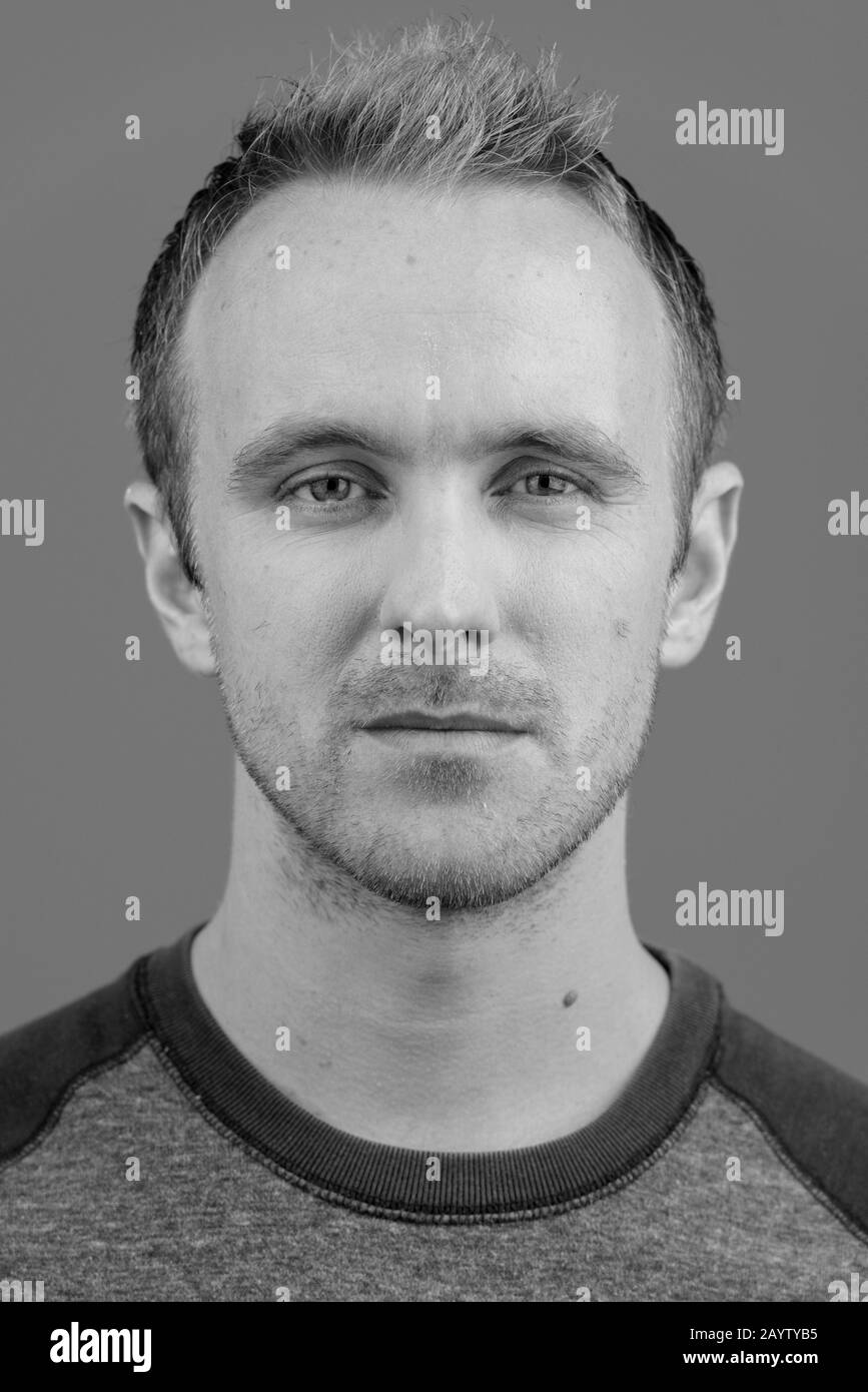 Face of handsome man against white background Stock Photo Alamy