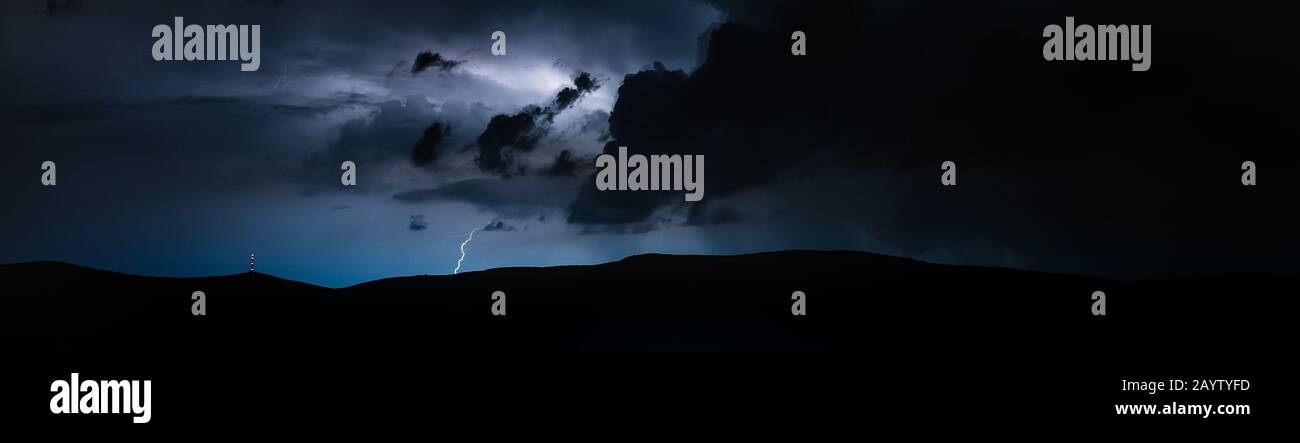 Storm raging in mountains with litghtning and thunder Stock Photo - Alamy