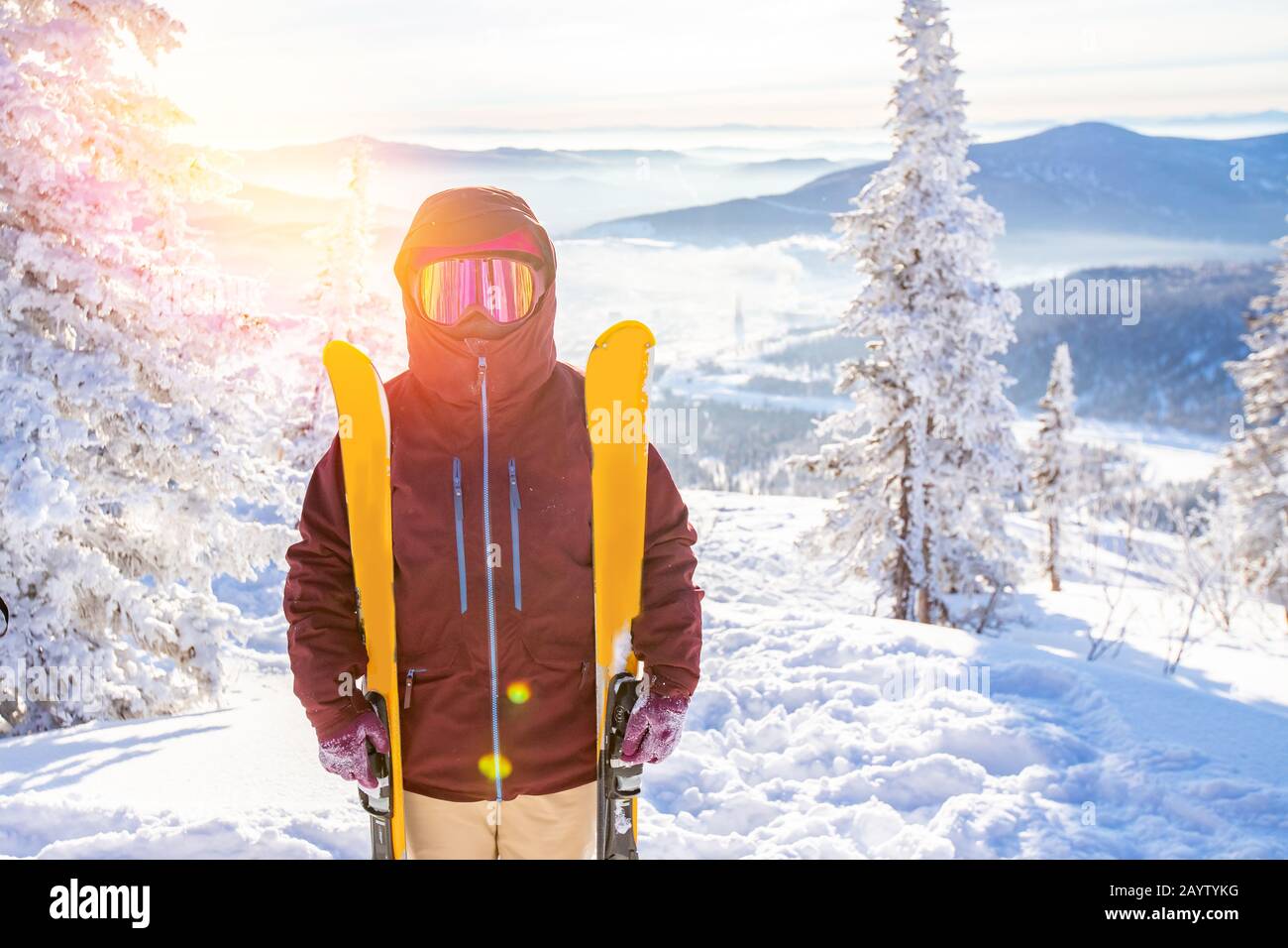 Download Portrait Of Skier In Protective Mask With Yellow Skis On Background Of Snowy Mountains And Forest Sunlight Stock Photo Alamy PSD Mockup Templates