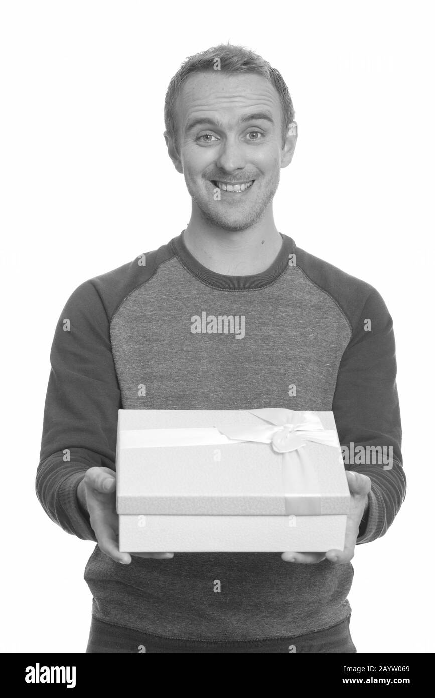 Portrait of happy handsome man with gift box Stock Photo