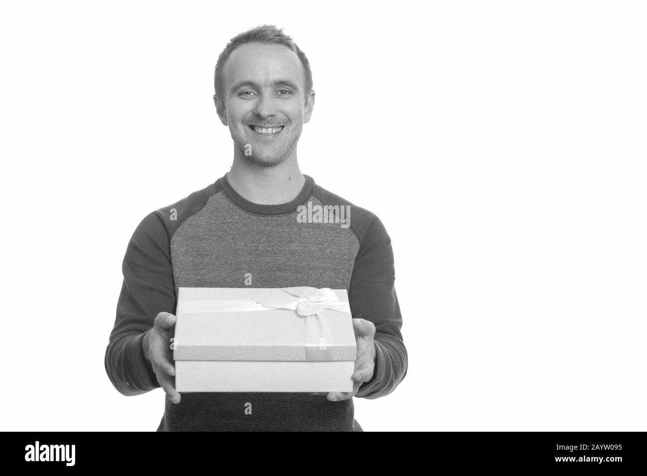Portrait of happy handsome man with gift box Stock Photo