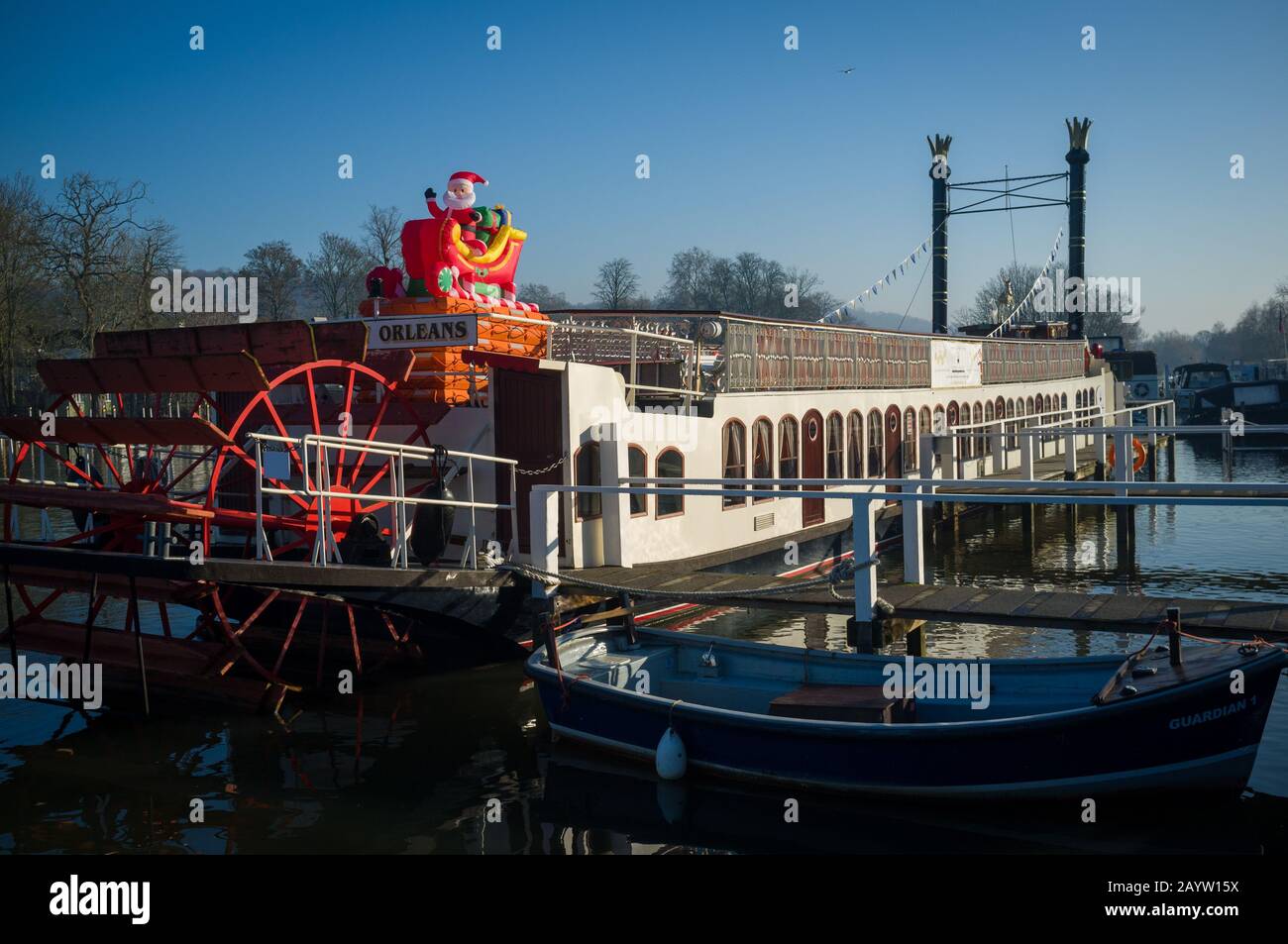 The pleasure cruiser 'New Orleans' moored by Hobbs boatyard at Christmas at Henley-on-Thames with an inflatable Santa Claus in a sleigh. Stock Photo