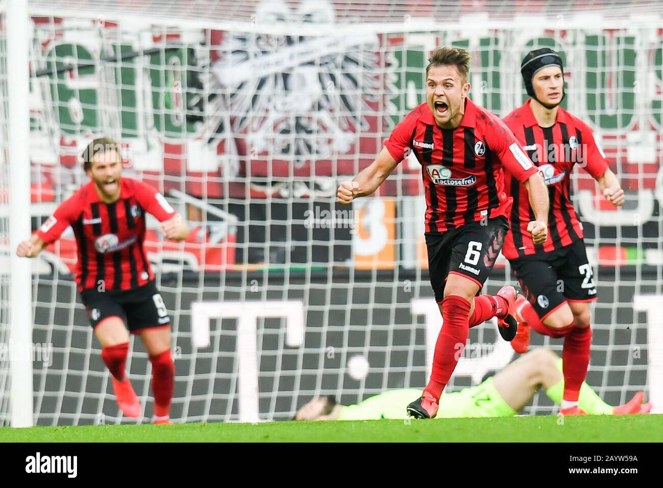 Augsburg, Germany. 15th Feb, 2020. Football: Bundesliga, 22nd matchday, FC Augsburg - SC Freiburg, WWK Arena. Freiburg's Amir Abrashi (M) cheers after Haberer's goal for 1:1. Credit: Tom Weller/dpa - IMPORTANT NOTE: In accordance with the regulations of the DFL Deutsche Fußball Liga and the DFB Deutscher Fußball-Bund, it is prohibited to exploit or have exploited in the stadium and/or from the game taken photographs in the form of sequence images and/or video-like photo series./dpa/Alamy Live News Stock Photo