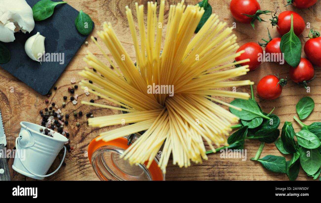 Download Flat Lay Of Spaghetti Ingredients Recipe A Tomato Went Through A Cheese Grater And Little Cherry Tomato Comes Out Still Life Food Photography Garlic H Stock Photo Alamy