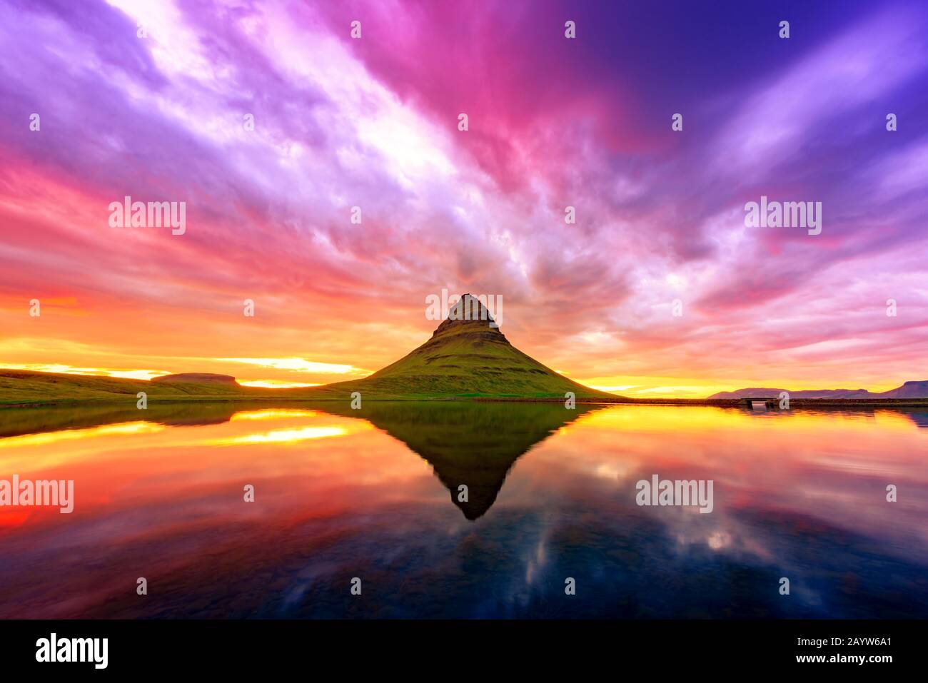 Gorgeous landscape with Kirkjufell mountain and colorful sunset sky on Snaefellsnes peninsula near, Iceland. Stock Photo