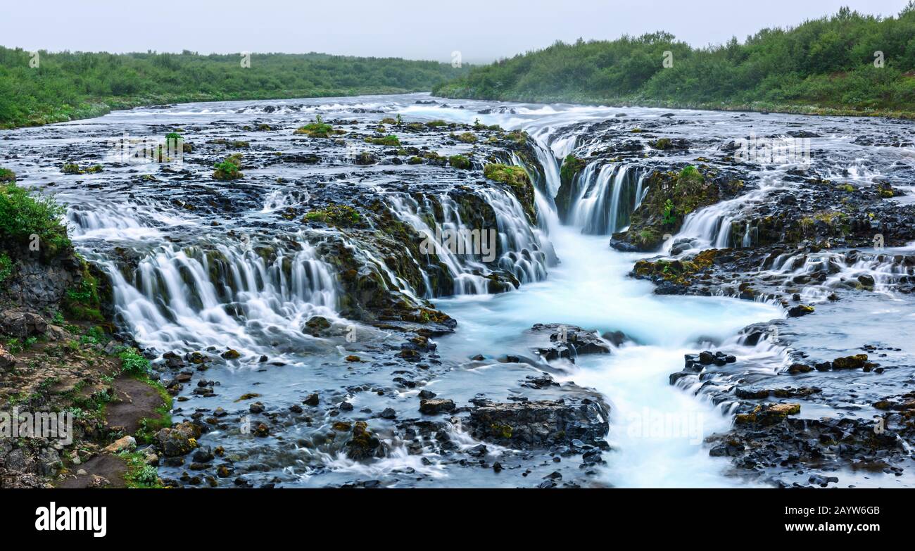 Panoramical view of famous Bruarfoss waterfall with blue water in summer time. Iceland, Europe Stock Photo