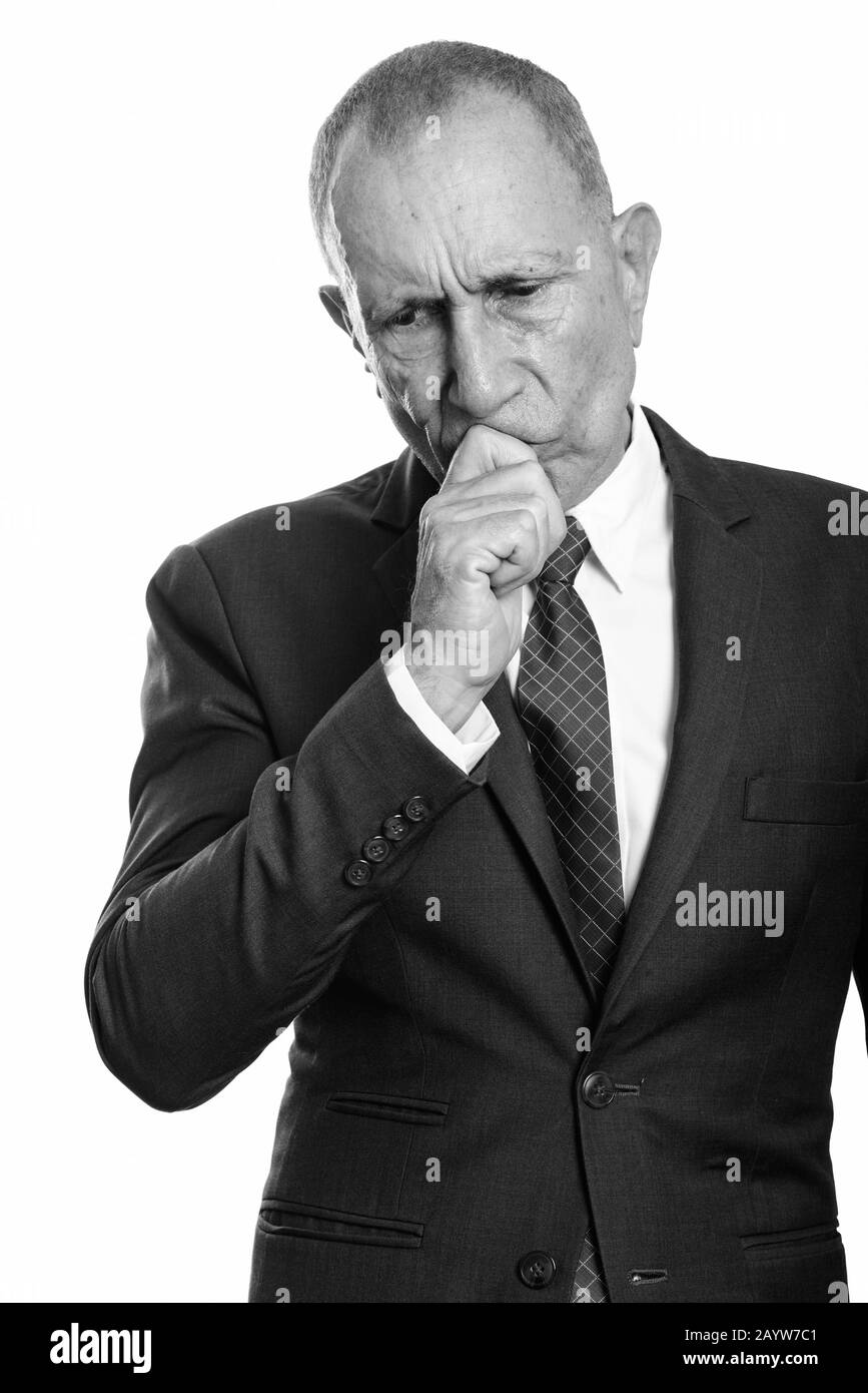 Studio shot of sad senior businessman thinking Stock Photo