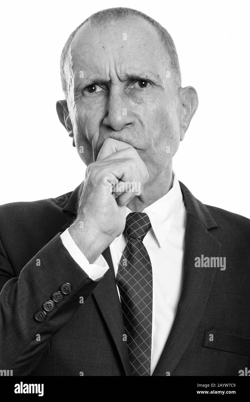 Face of angry senior businessman thinking Stock Photo