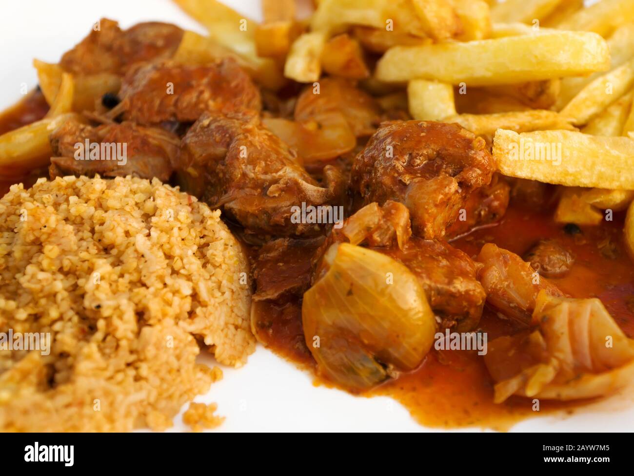 Traditional Greek Beef Stifado with rice and french fries Stock Photo