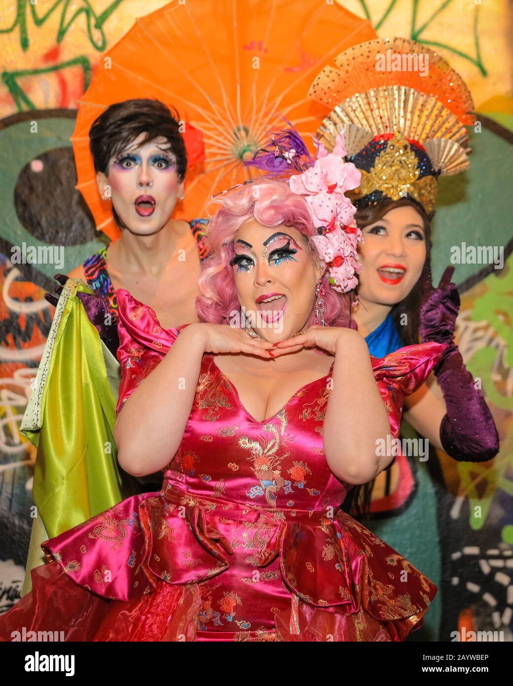 Waterloo, London, 17th Feb 2020. Drag collective Bitten Peach (ShayShay with umbrella, Lilly Snatchdragon in pink dress and wig, and Evelyn Carnate, in blue top) go underground in the graffiti-clad tunnels in Waterloo to celebrate London's VAULT Festival. The festival has returned for its eighth year with eight weeks of the best new theatre and comedy, immersive experiences, cabaret, live performance and late-night parties. VAULT Festival runs until March 22nd. Credit: Imageplotter/Alamy Live News Stock Photo