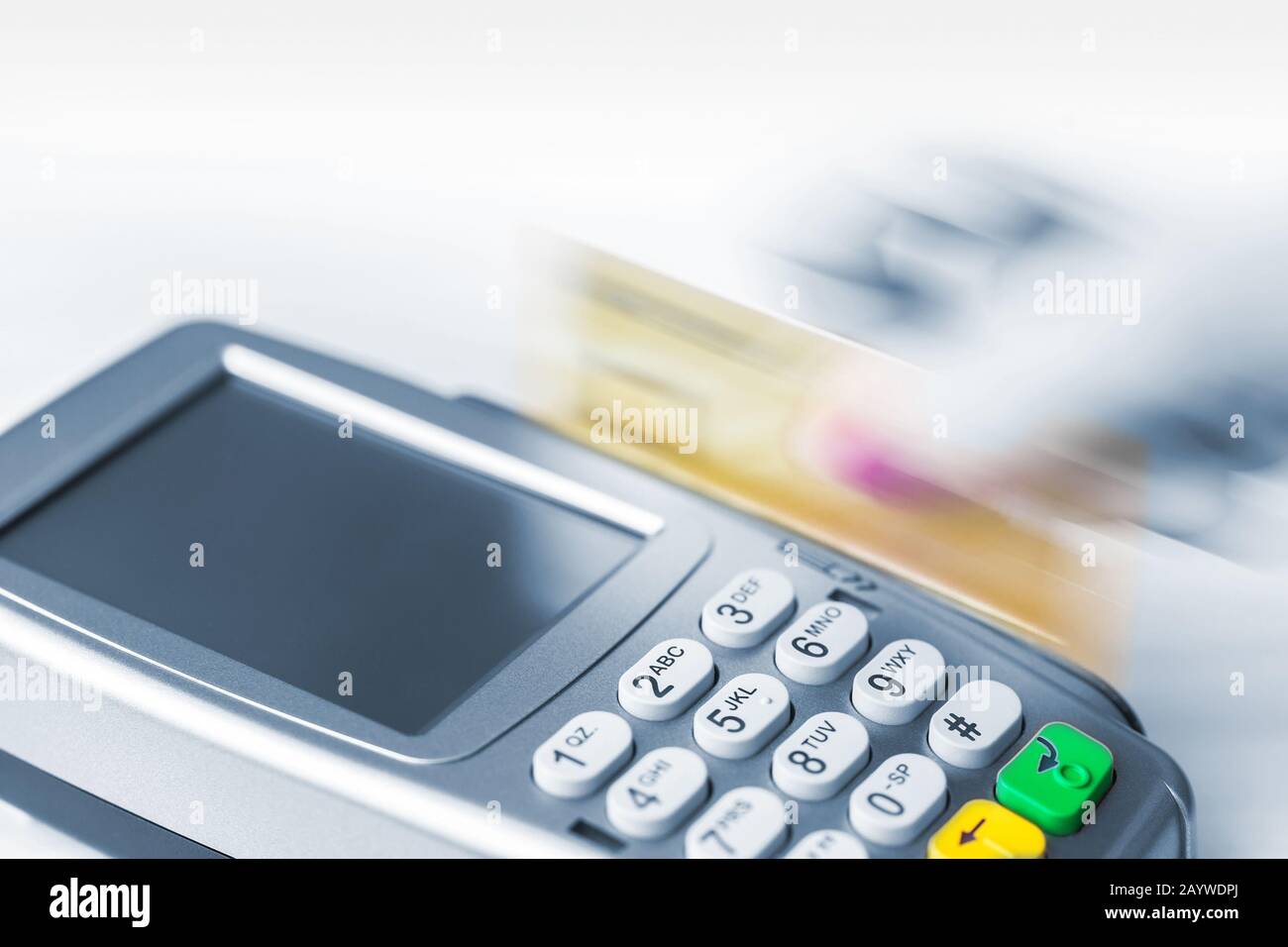 Payment by credit card with a magnetic strip. Movement, dynamics. Stock Photo