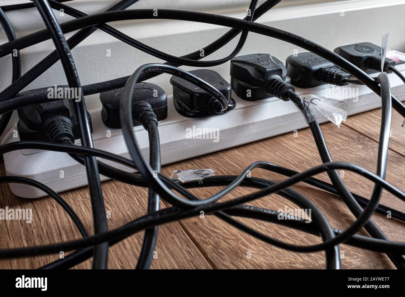 Multiple electrical plugs in a home office Stock Photo Alamy