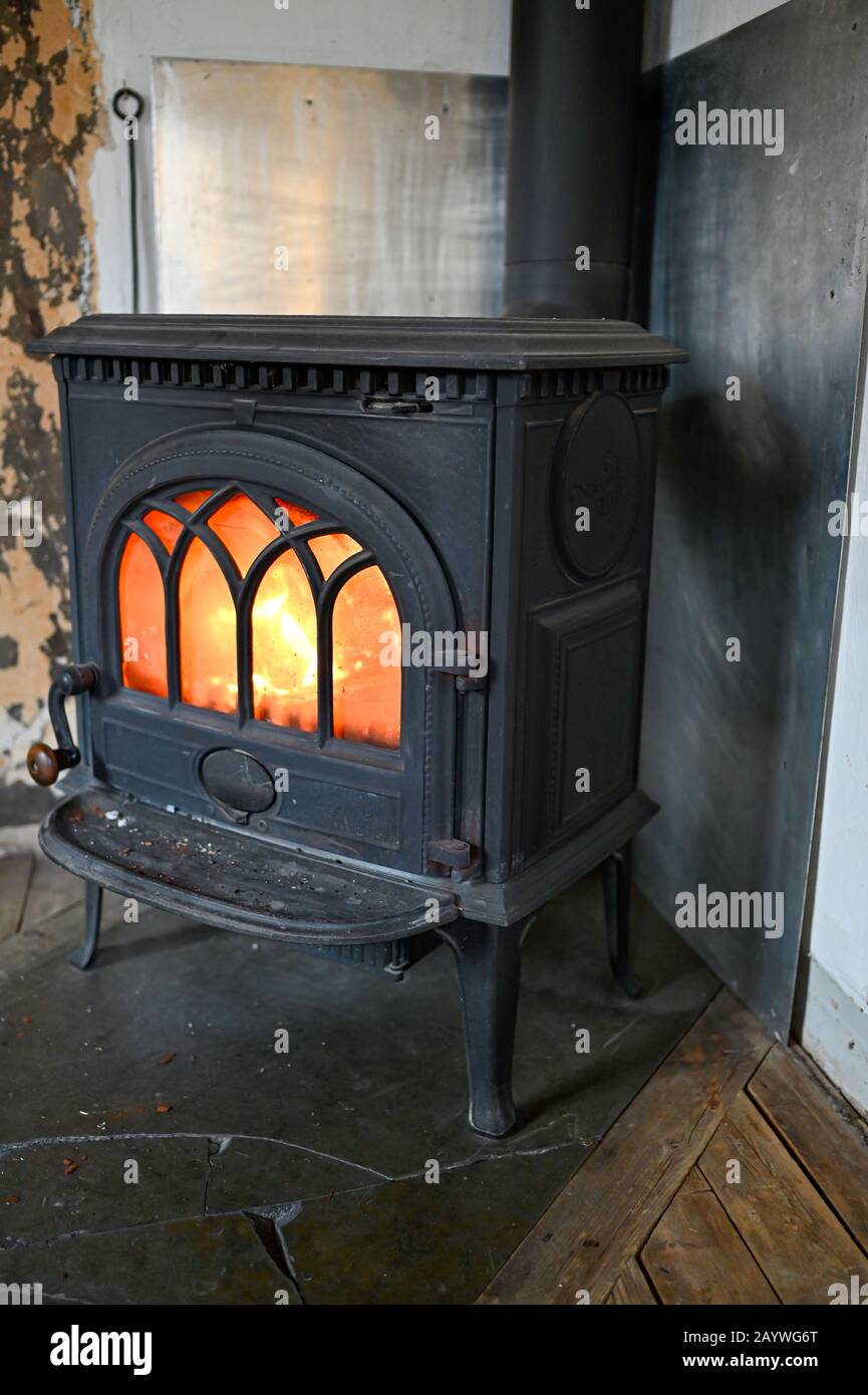 indoor fire in a cast iron stove in a Swedish home Stock Photo