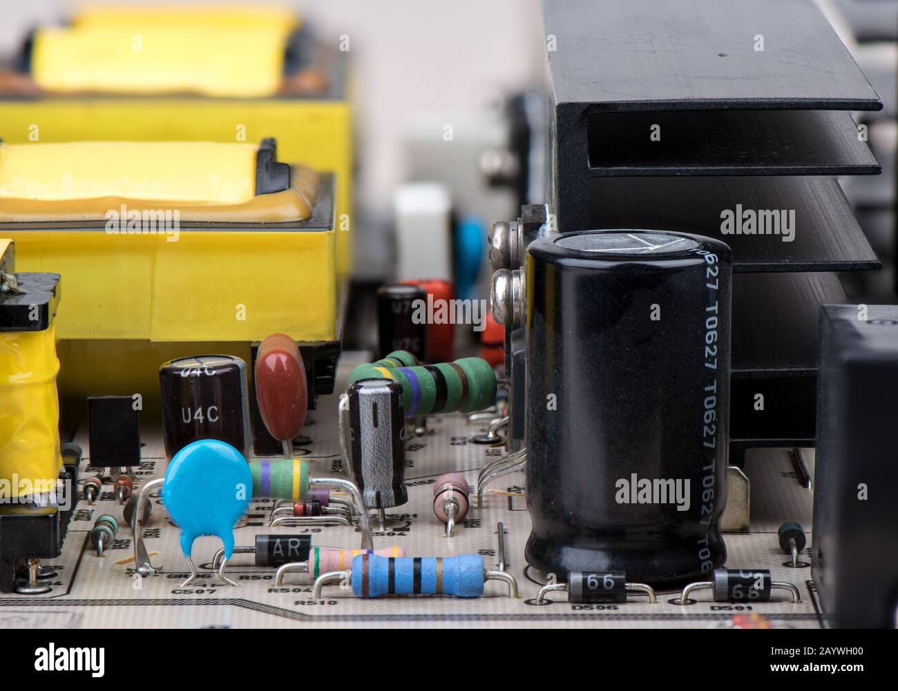 Closeup of resistors, capacitors and other electronic components. The