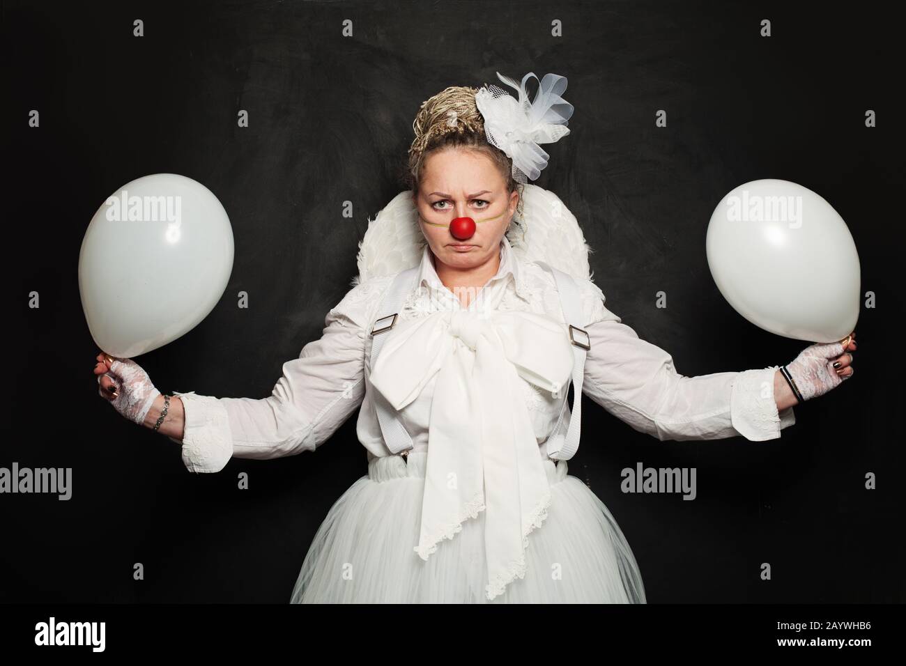 Performance Actress at work, White Clown Character Stock Photo
