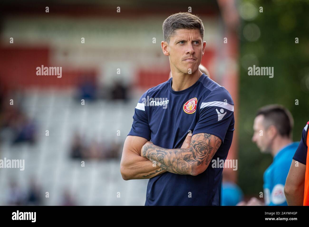 Football coach Alex Revell standing pitch side during game whilst manager at Stevenage FC Stock Photo
