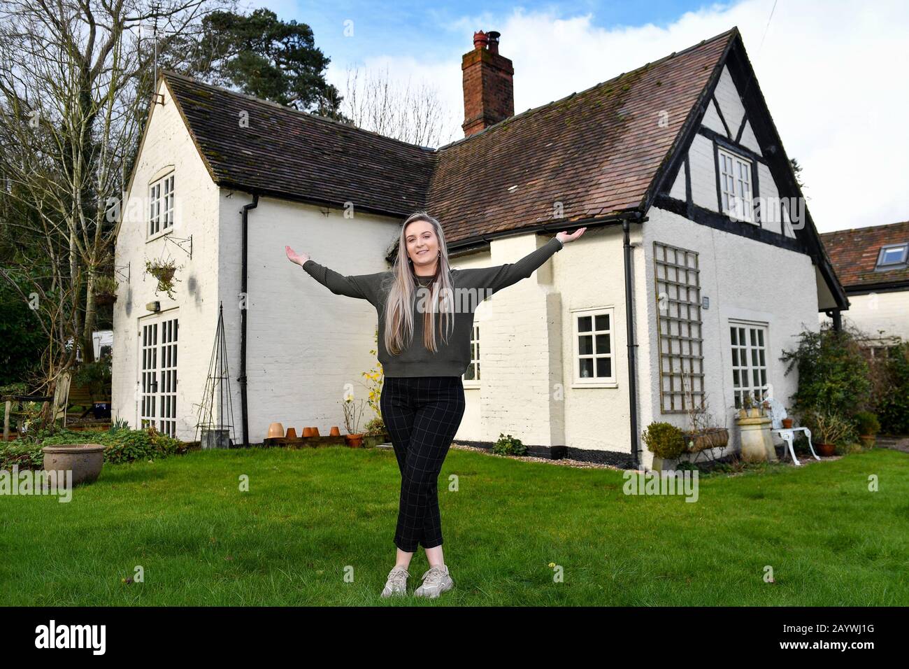 Jemma Nicklin, 23, celebrates during her first visit to Shrubbery Farm in Longnor near Shrewsbury, a 300-year-old four bedroom farmhouse which she won after buying two £2 tickets in a raffle organised by owner Mike Chatha. Stock Photo
