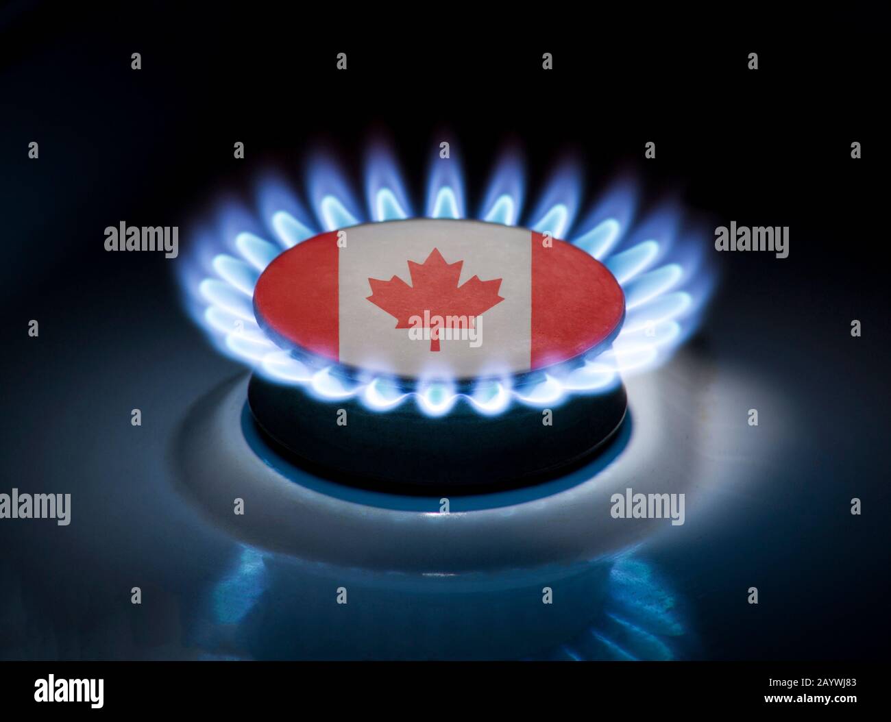 Burning gas burner of a home stove in the middle of which is the flag
