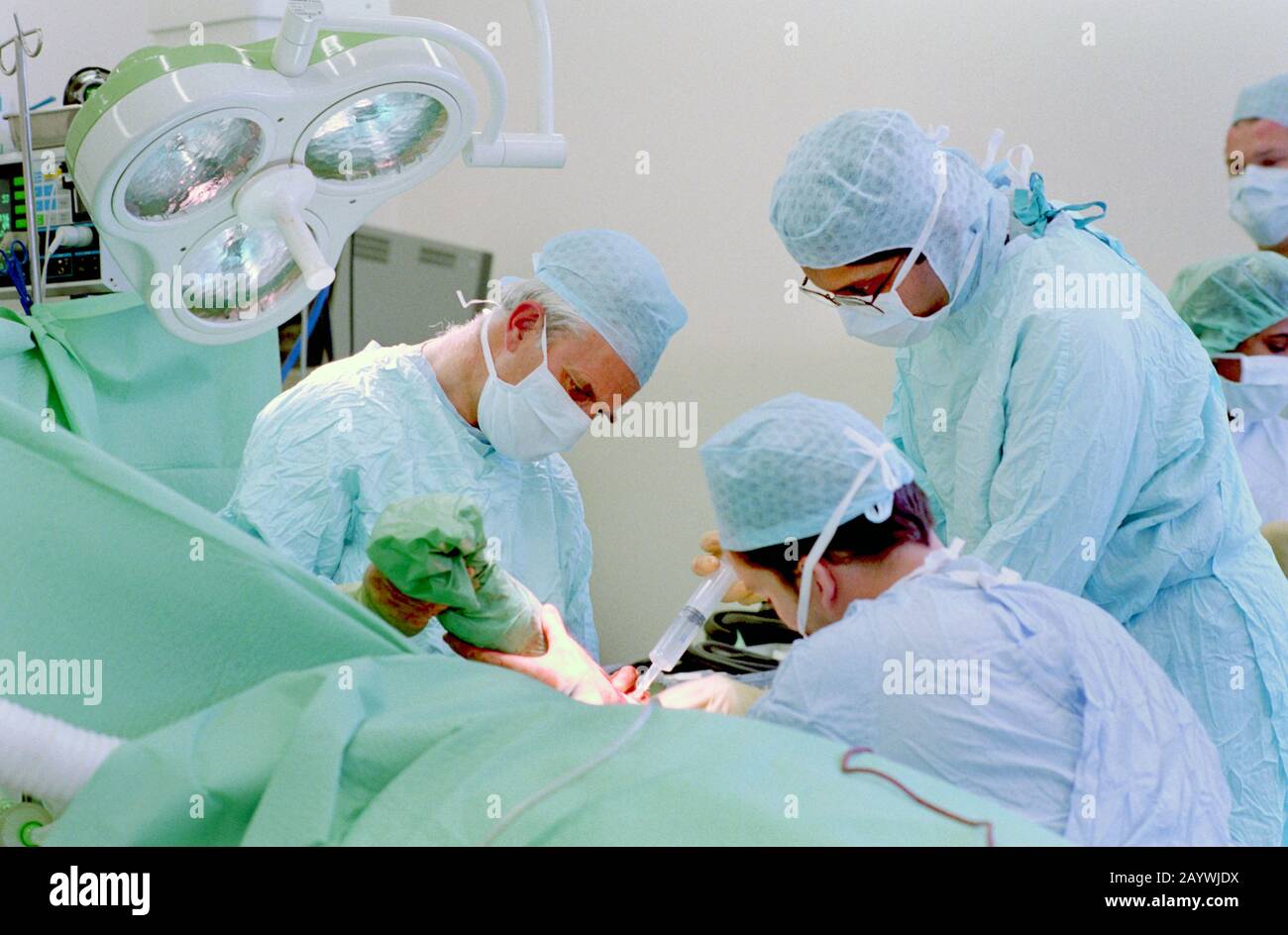 hospital theatre staff cleansing a surgical wound Stock Photo