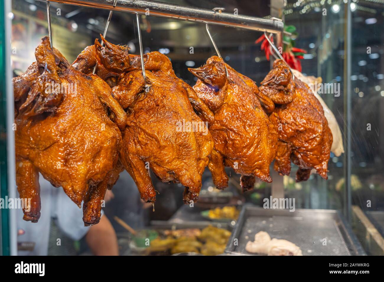 Delicious roasted whole chickens displayed in Singapore food restaurant