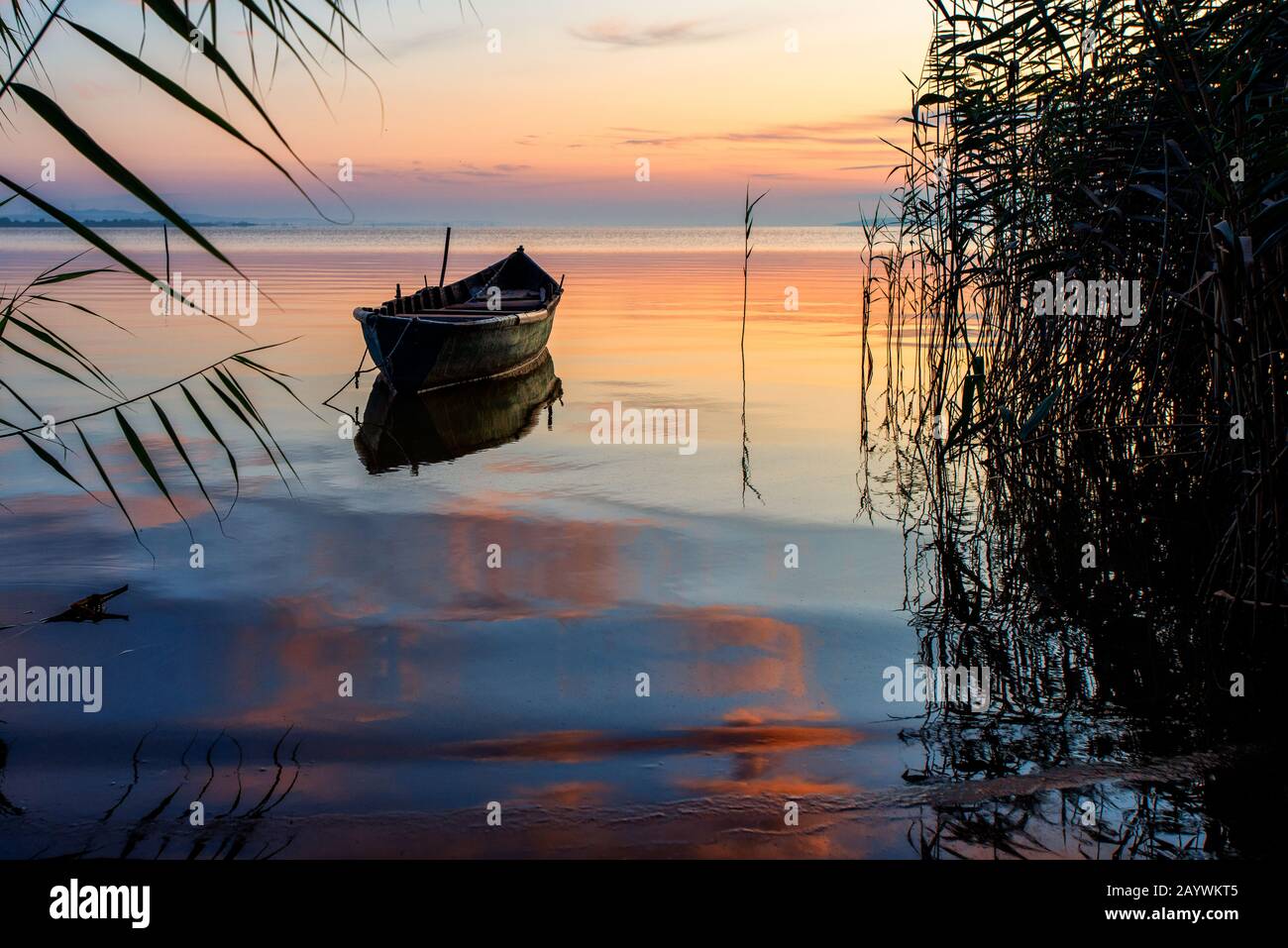 beautiful lake at sunset time and boat Stock Photo - Alamy