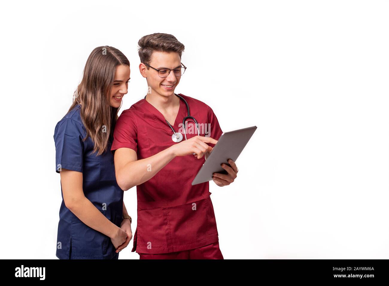 Young doctors analyzing patient results on a tablet Stock Photo