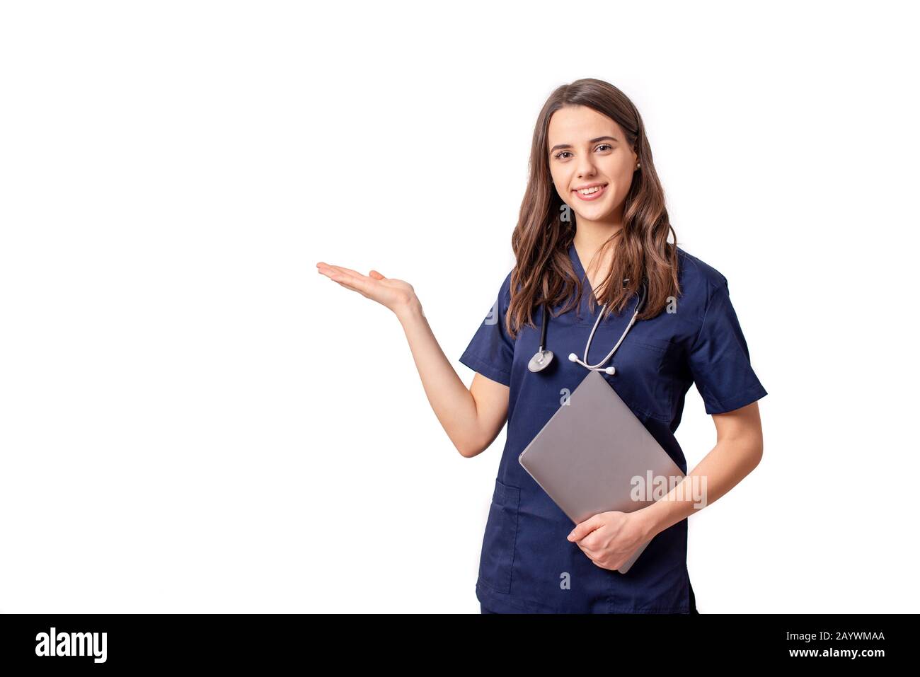Young female doctor showing something with hands extended - isolated over white Stock Photo