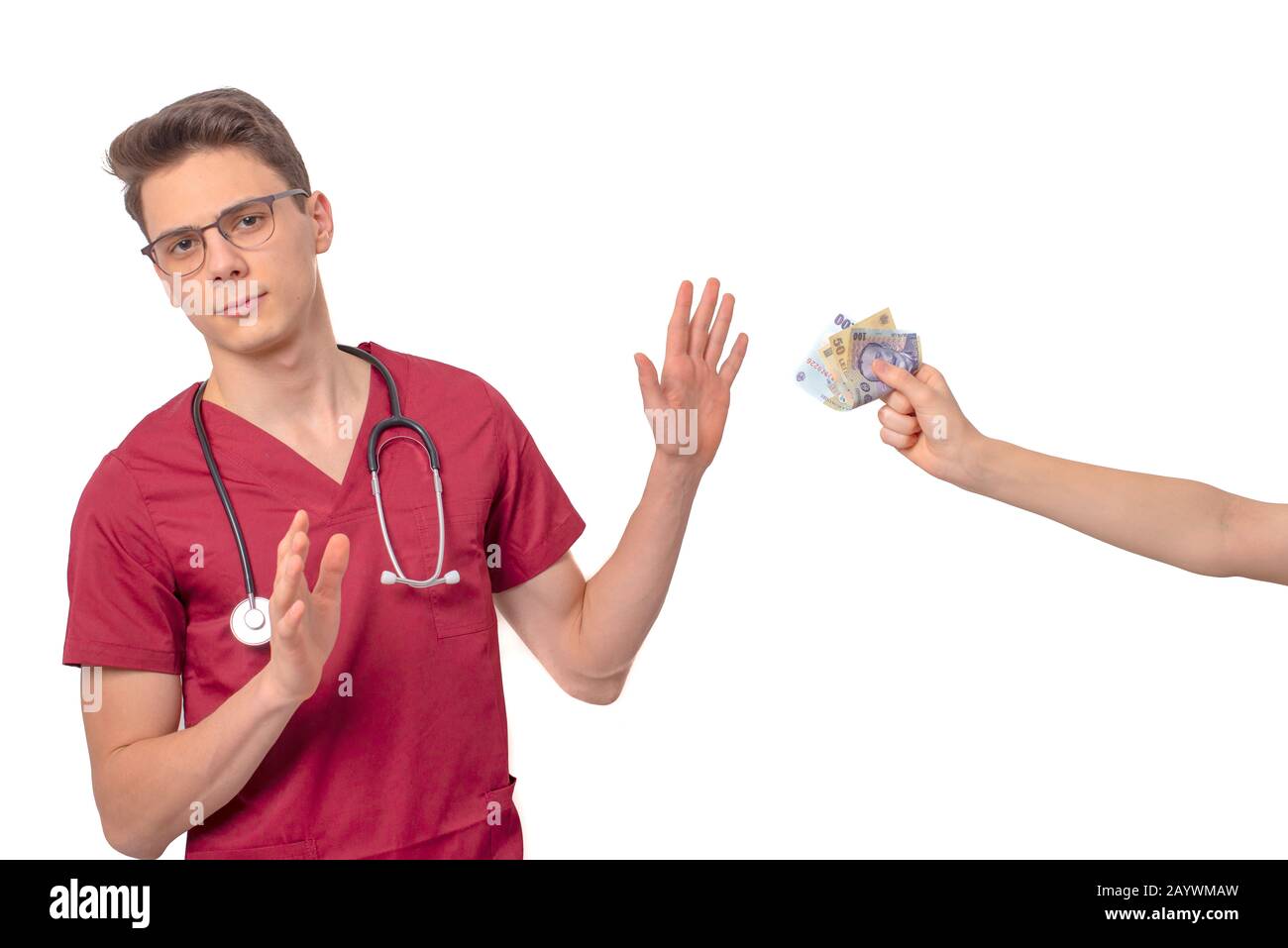 Young doctor refusing bribe in exchange for his services Stock Photo