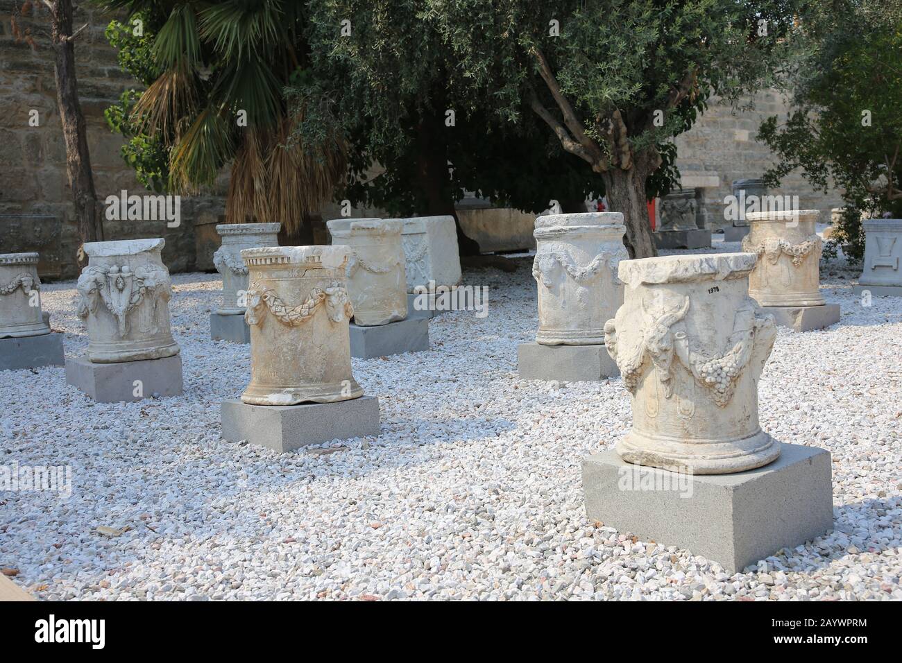 Well-heads (classical puteal). Decorated with reliefs of bulls'heads with garlands. Castle of Bodrum. Turkey. Stock Photo