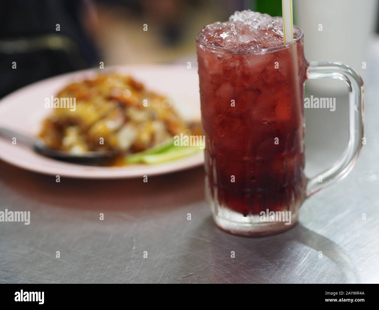 Black iced tea Drink in Crystal clear water and roasted red pork food Stock Photo Alamy