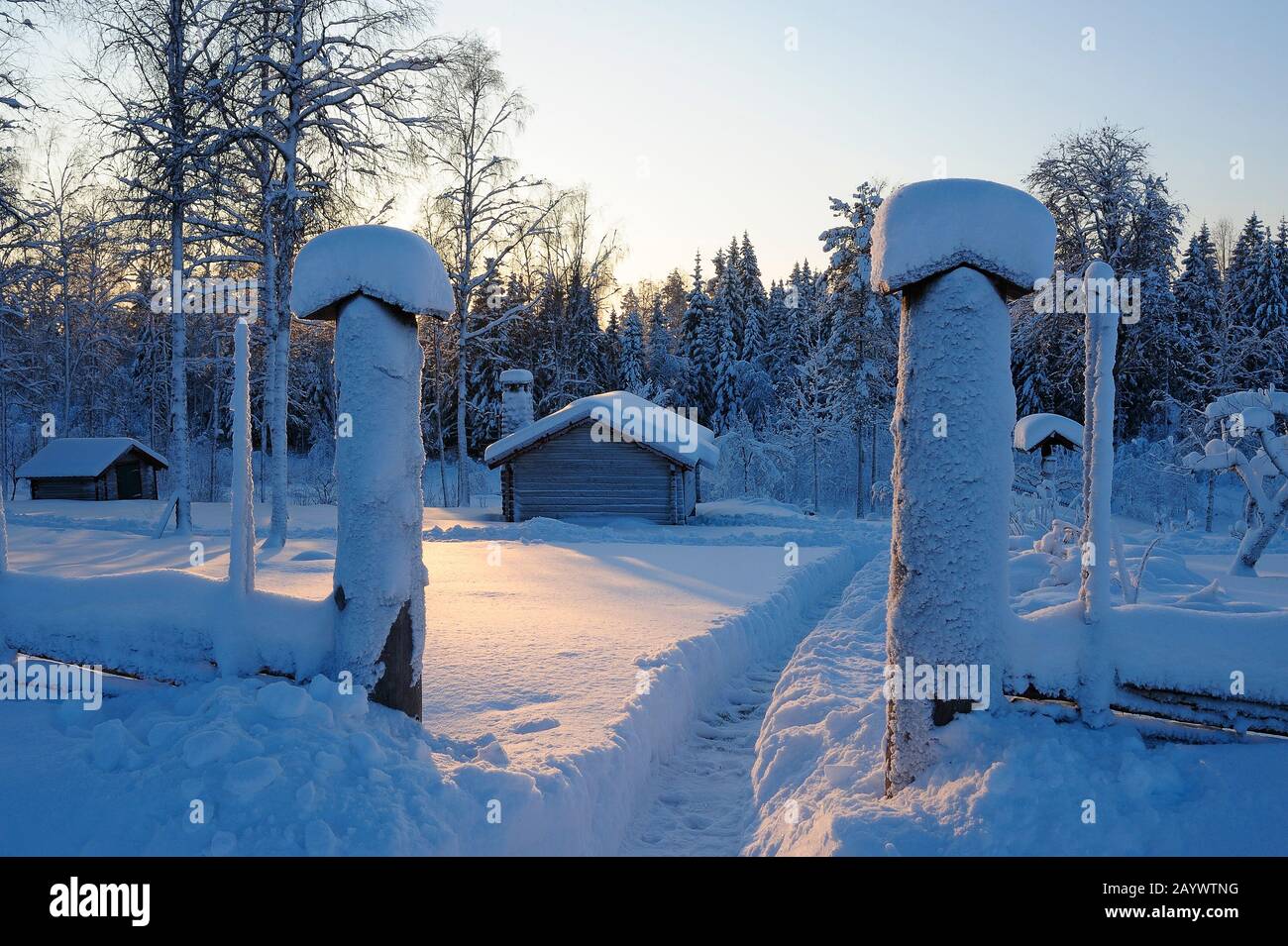 Winter sunset by a log-house, Boda kyrkby, Dalarna, Sweden, Scandinavia Stock Photo
