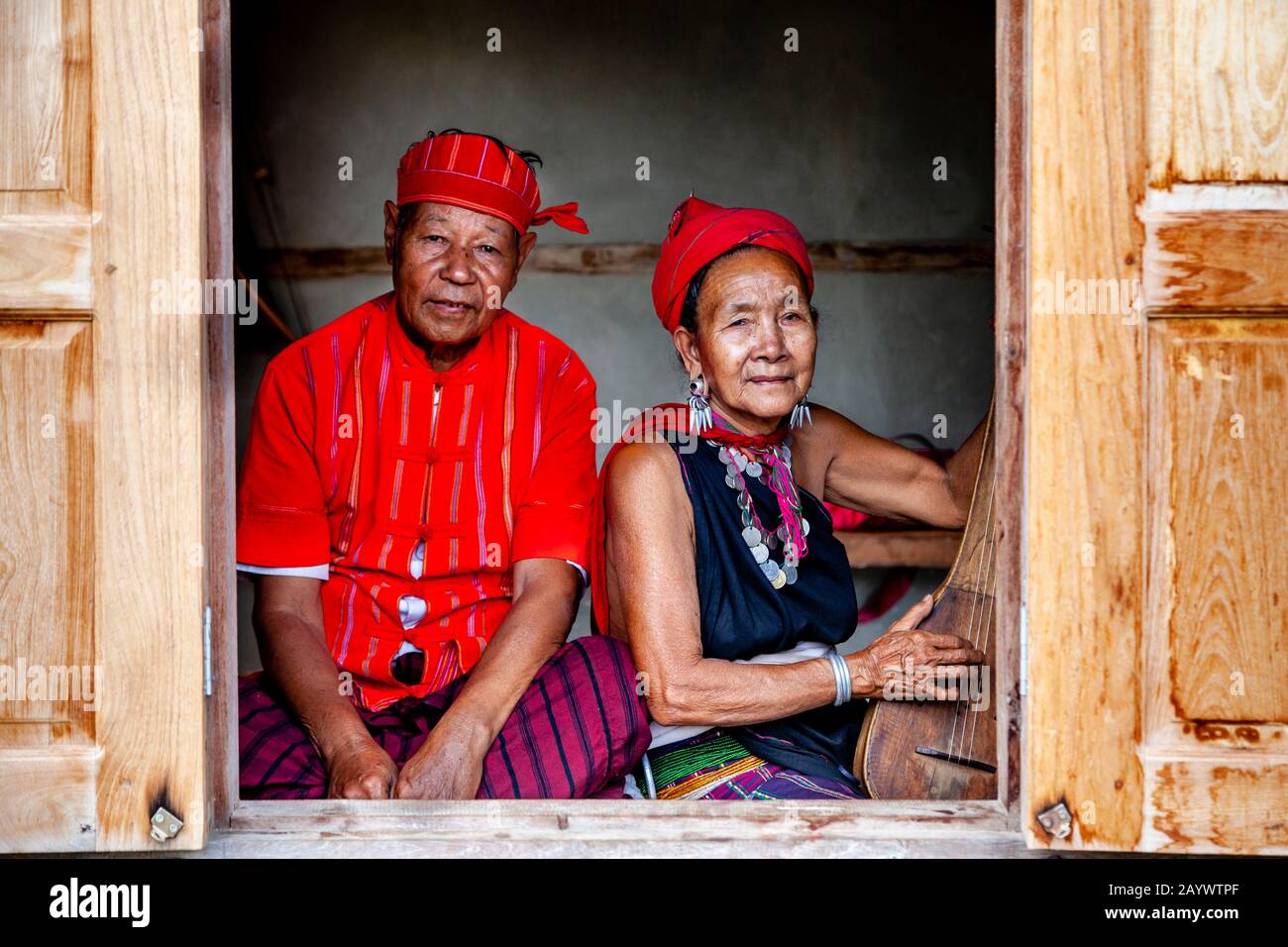 A Senior Couple From The Kayah Ethnic Group Inside Their Home, Hta Nee La Leh Village, Loikaw, Kayah State, Myanmar. Stock Photo