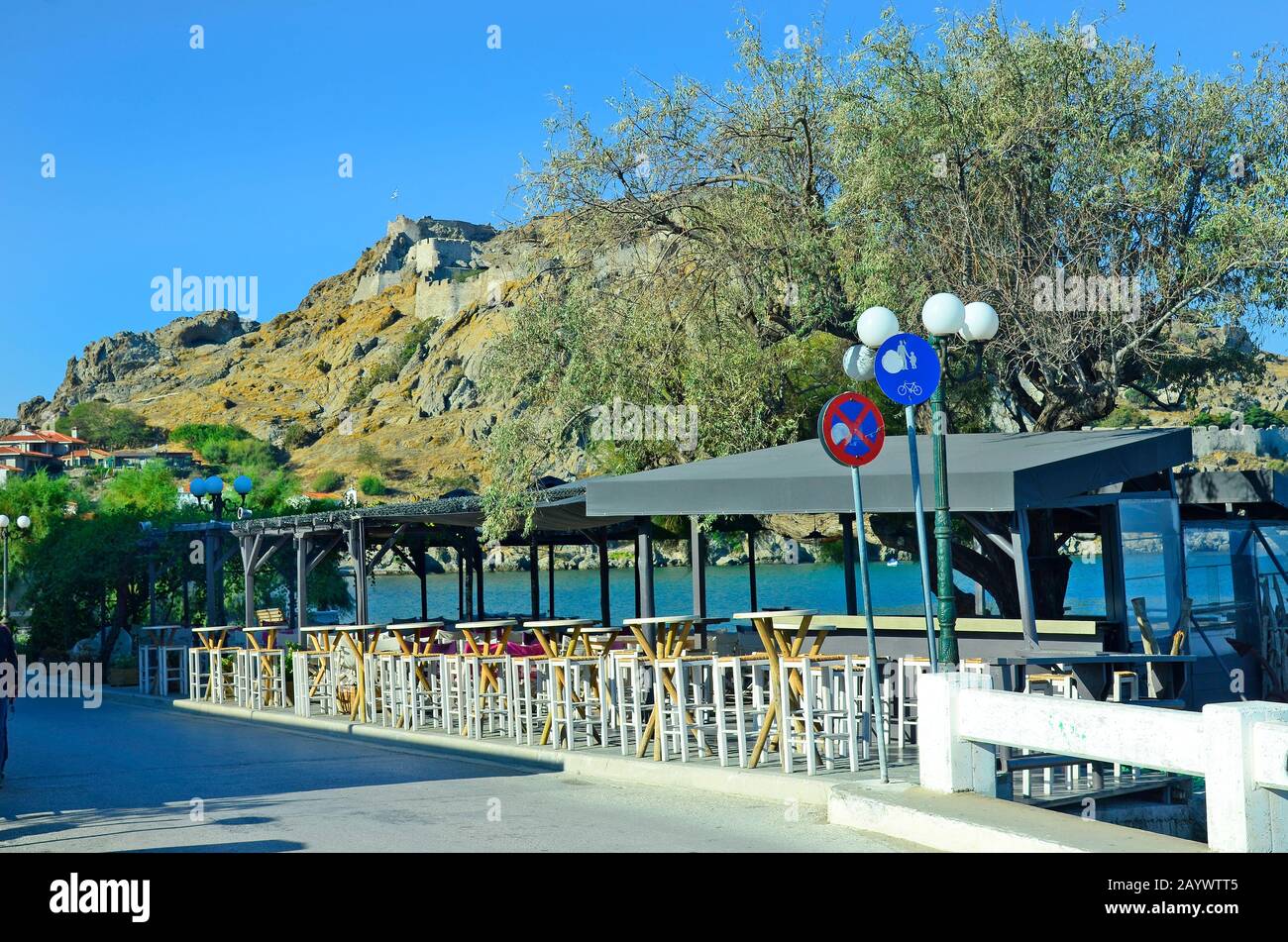 Greece, fortress of Myrina on Lemnos Island with restaurants in front Stock Photo